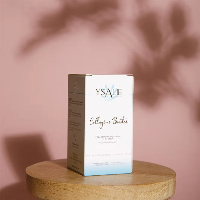 Boîte du complément alimentaire Collagène Booster qui agit sur la fermeté de la peau, il est représenté devant un fond rose.